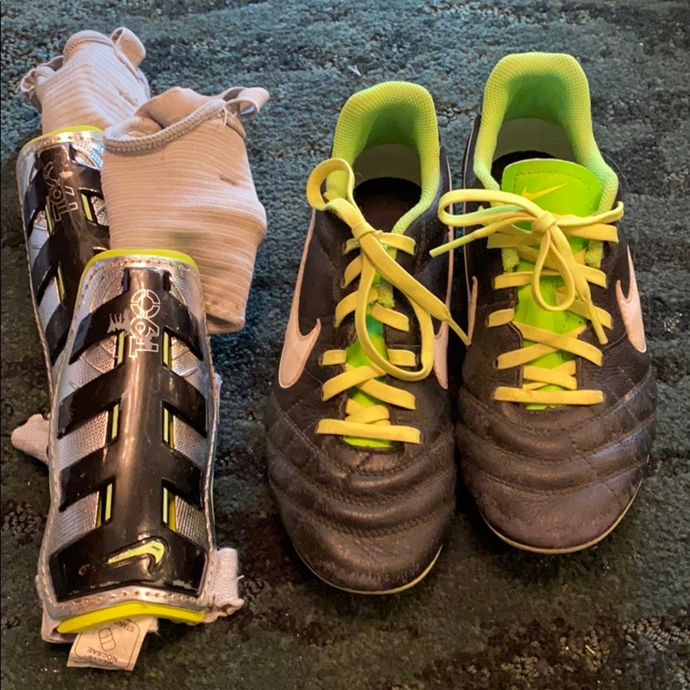 Soccer cleats and a pair of shin guards